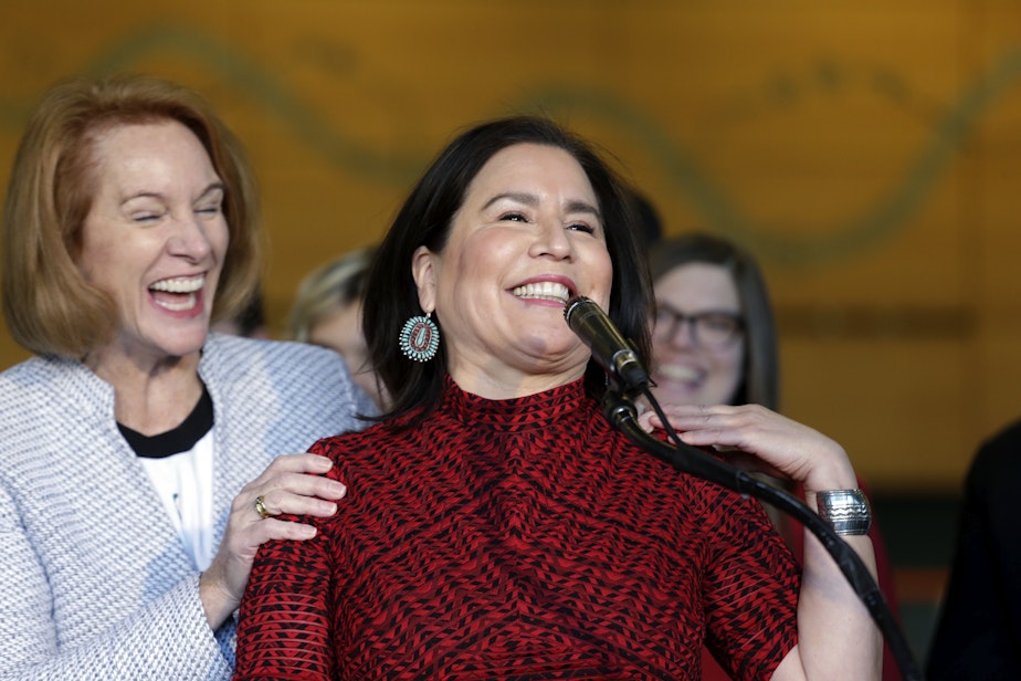 caption: Seattle Mayor Jenny Durkan, left, playfully interrupted Seattle City Councilmember Debora Juarez as Juarez spoke about the renovation of KeyArena, Wednesday, Dec. 6, 2017, in Seattle. 