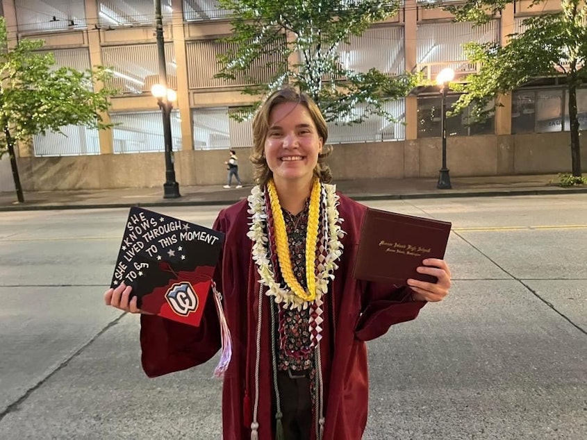 caption: Renn Novak poses for a photo after her graduation from Mercer Island High School.