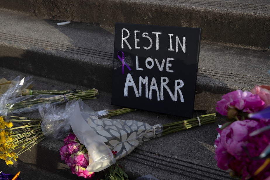 caption: ‘Rest in love Amarr’ reads a sign during a unity walk in honor of 17-year-old Garfield high school student Amarr Murphy Paine, who was shot and killed at school, on Thursday, June 13, 2024, in Seattle. 