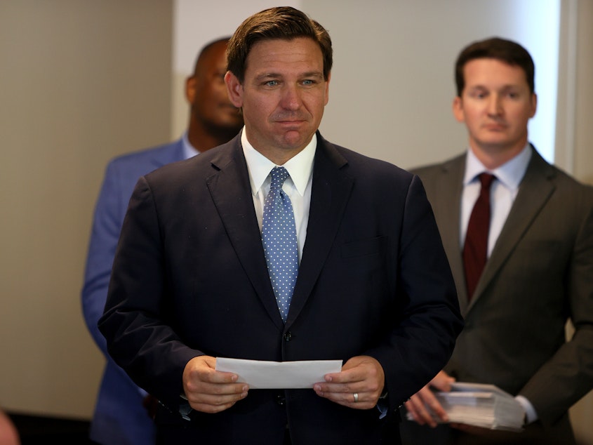 caption: Florida Gov. Ron DeSantis (shown here in August) has appointed a new surgeon general who does not believe in vaccine mandates.