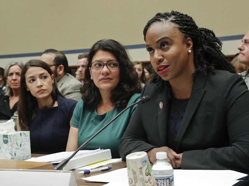 caption: Reps. Alexandria Ocasio-Cortez, Rashida Tlaib, and Ayanna Pressley, three of the four Congresswomen President Trump has attacked on twitter, during a House hearing last week.