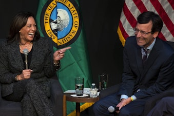 caption: Senator Kamala Harris laughs with Washington state Attorney General Bob Ferguson during a gun safety roundtable on Friday, September 27, 2019, at Langston Hughes Performing Arts Institute in Seattle.