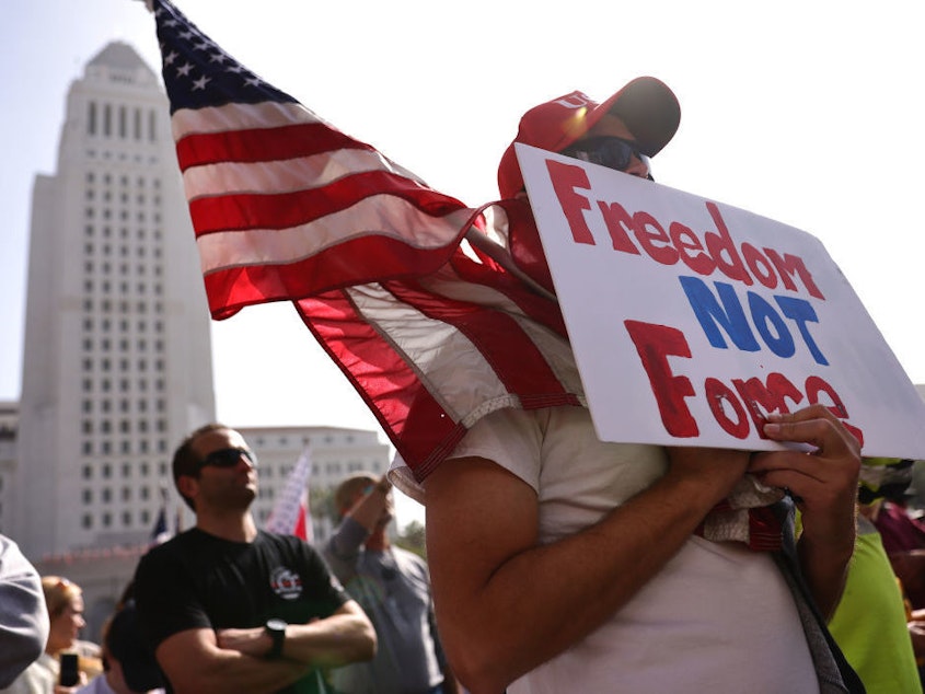 caption: Protesters gather in Grand Park at a "March for Freedom" rally demonstrating against the L.A. City Council's COVID-19 vaccine mandate for city employees and contractors on Monday in Los Angeles. A new study from Pew Research Center breaks down ideology within political parties, including on the role of government.