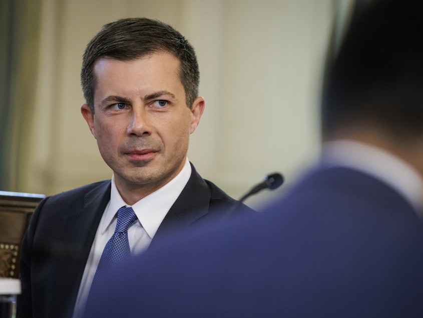 caption: Transportation Secretary Pete Buttigieg during a meeting of President Biden's Competition Council in the State Dining Room of the White House in Washington, D.C., on Wednesday.