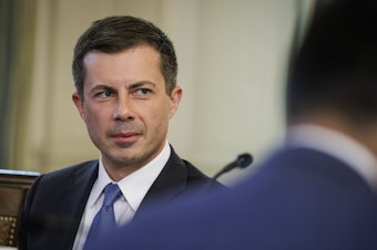 caption: Transportation Secretary Pete Buttigieg during a meeting of President Biden's Competition Council in the State Dining Room of the White House in Washington, D.C., on Wednesday.