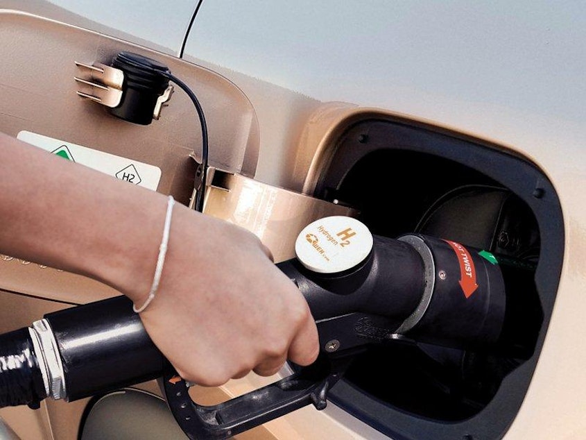 caption: Refueling a vehicle at a hydrogen gas pump could be a familiar, speedy routine akin to how consumers refuel gasoline-powered cars today.