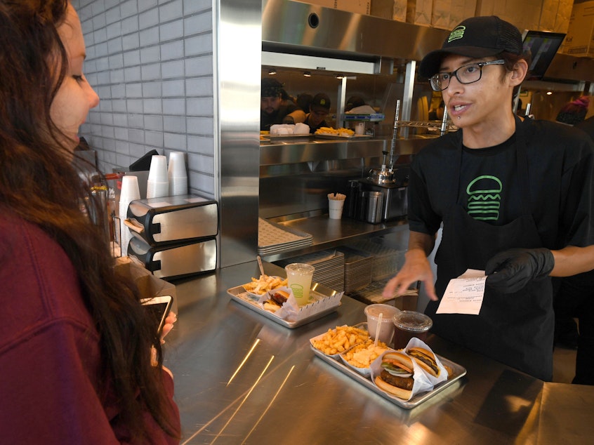 caption: Shake Shack shortened managers' workweeks to four days at some stores a year and a half ago. Recently, the burger chain expanded the trial to a third of its U.S. stores.