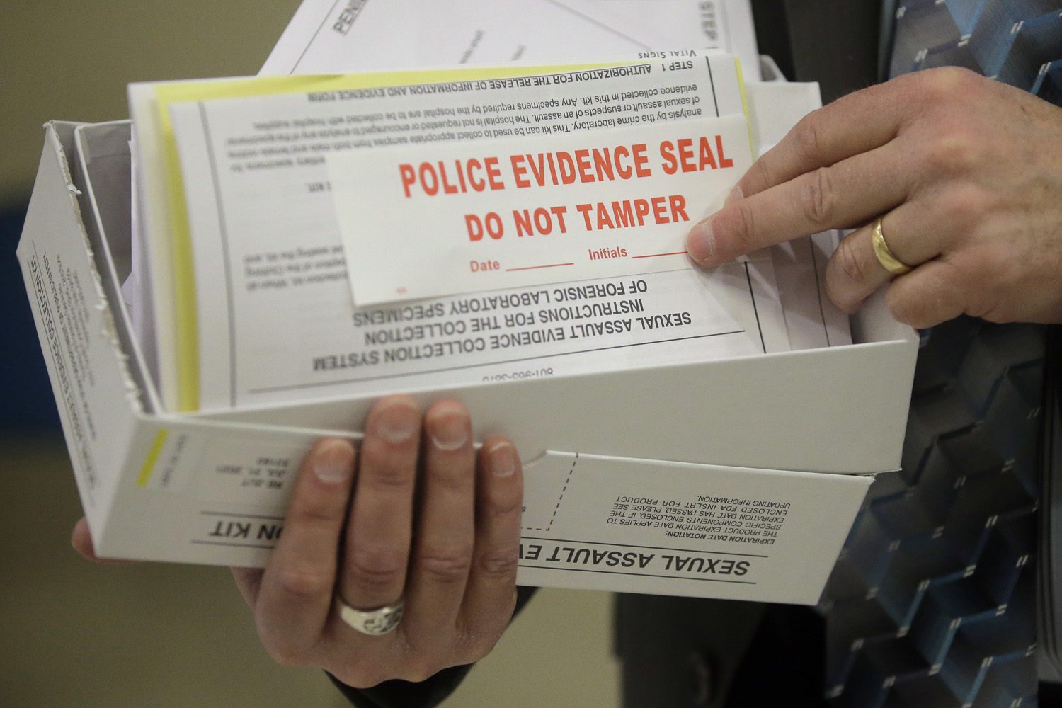 caption: In this Feb. 8, 2017, photo, Utah State Crime Lab Director Jay Henry holds a sexual assault evidence collection kit following a committee meeting at the Utah State Capitol, in Salt Lake City. (Rick Bowmer/AP)