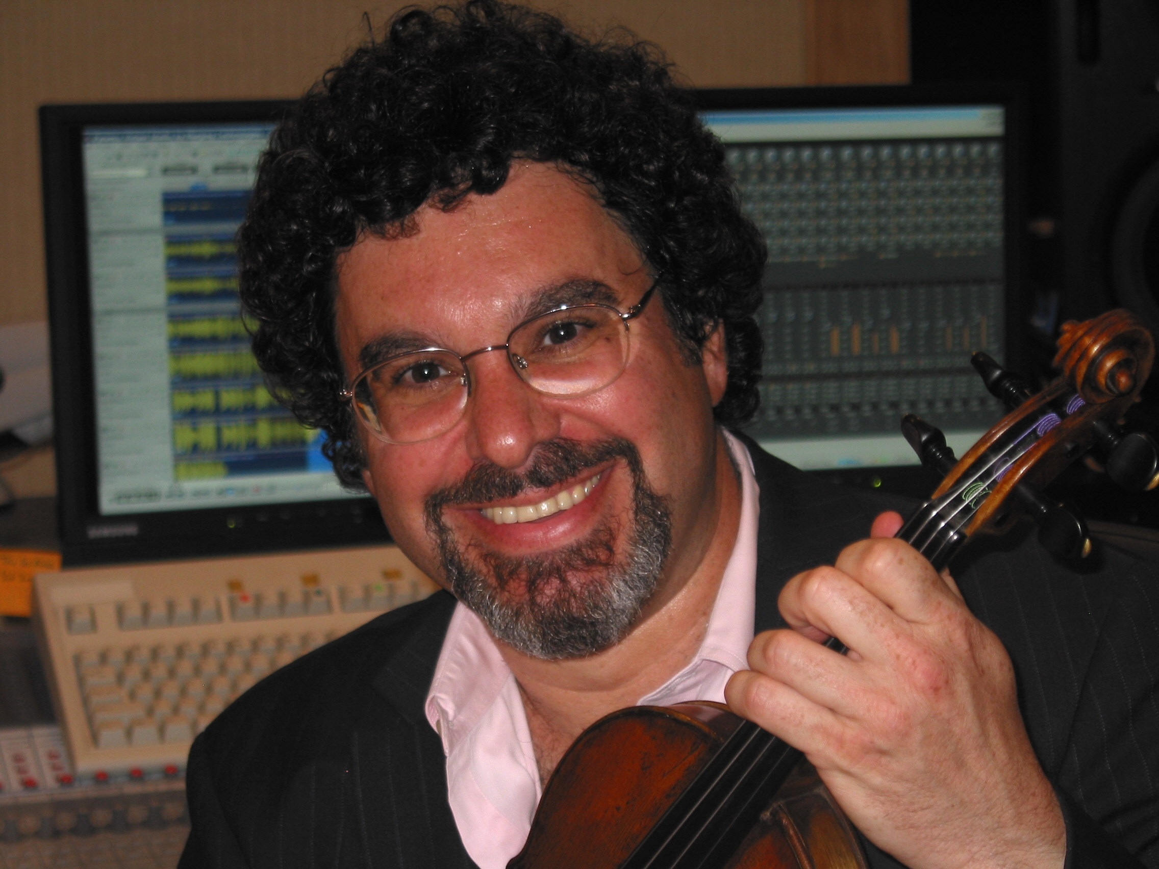 caption: Classical music producer Adam Abeshouse was diagnosed with bile duct cancer last spring. His clients — including Simone Dinnerstein, Jeremy Denk and Joshua Bell — performed a concert in his home studio to bid farewell. “I was just thinking of how many of us wanted to celebrate Adam while he’s still here,” said pianist Lara Downes, who organized the event.