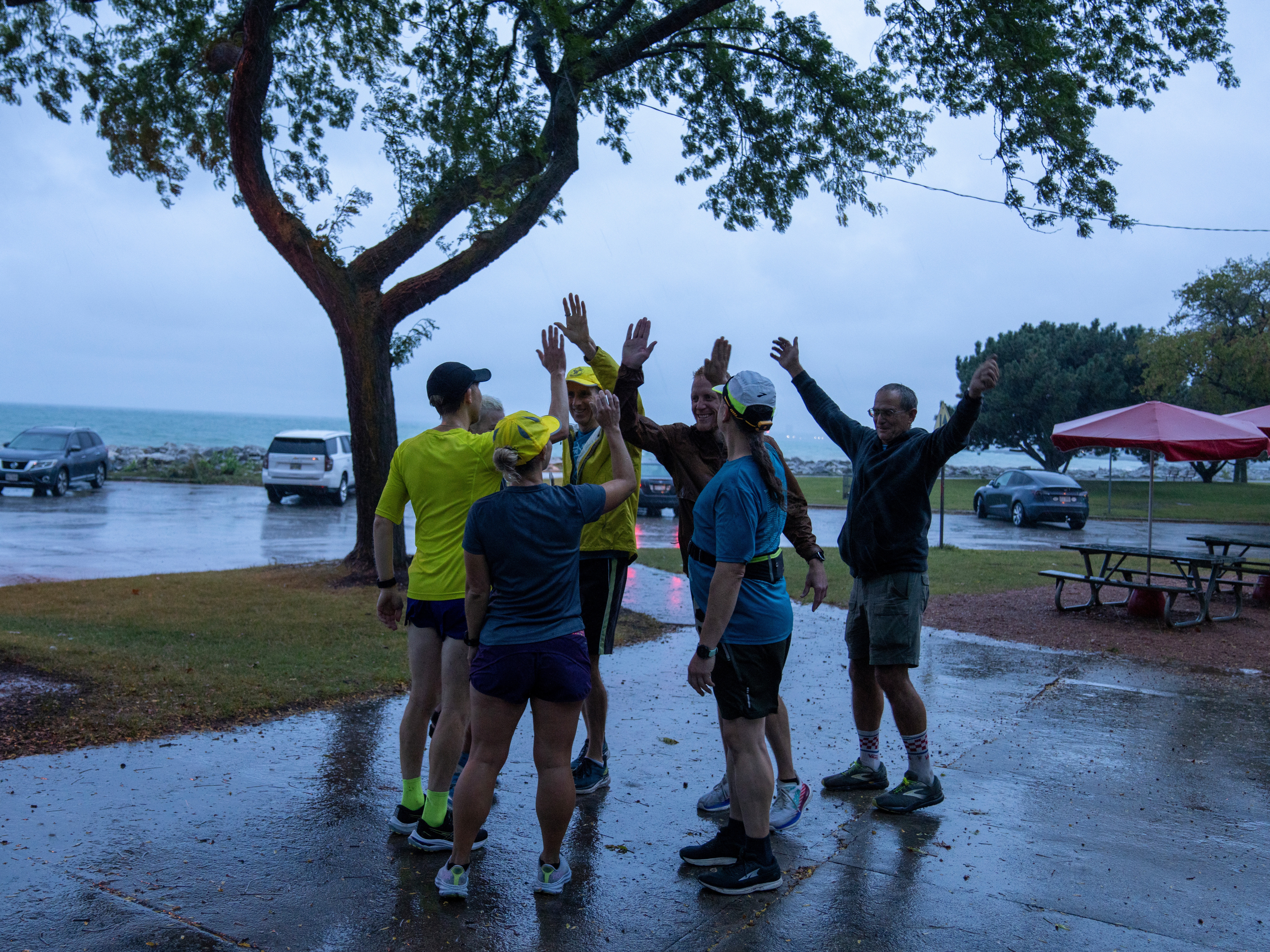 caption: The Milwaukee Running Group — OMG meets up on a rainy morning in Milwaukee recently.