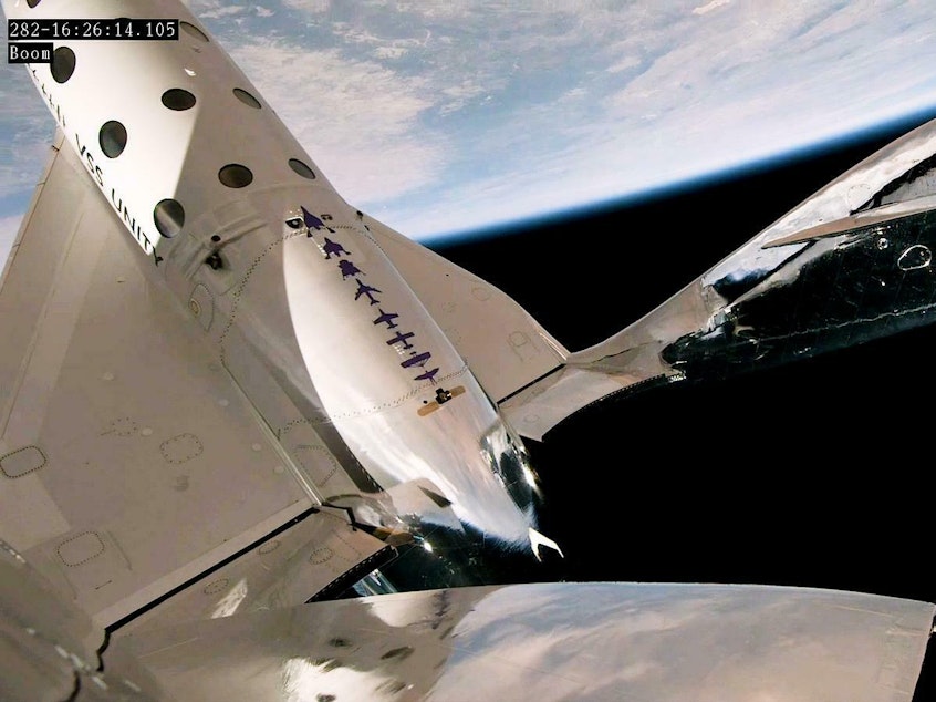 caption: The space plane "Unity" travelled 54 miles above Earth, providing a great view and a few minutes of weightlessness.