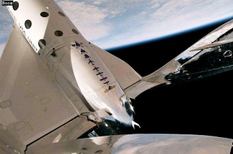 caption: The space plane "Unity" travelled 54 miles above Earth, providing a great view and a few minutes of weightlessness.