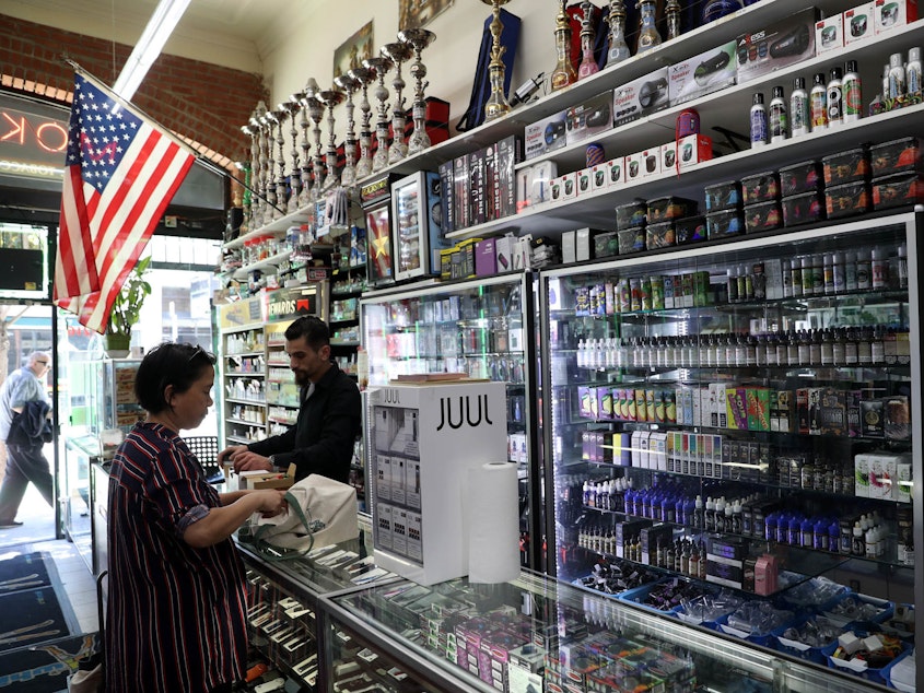 caption: E-Cigarette vaporizer components and products are displayed at Smoke and Gift Shop on June 25, 2019 in San Francisco, California.