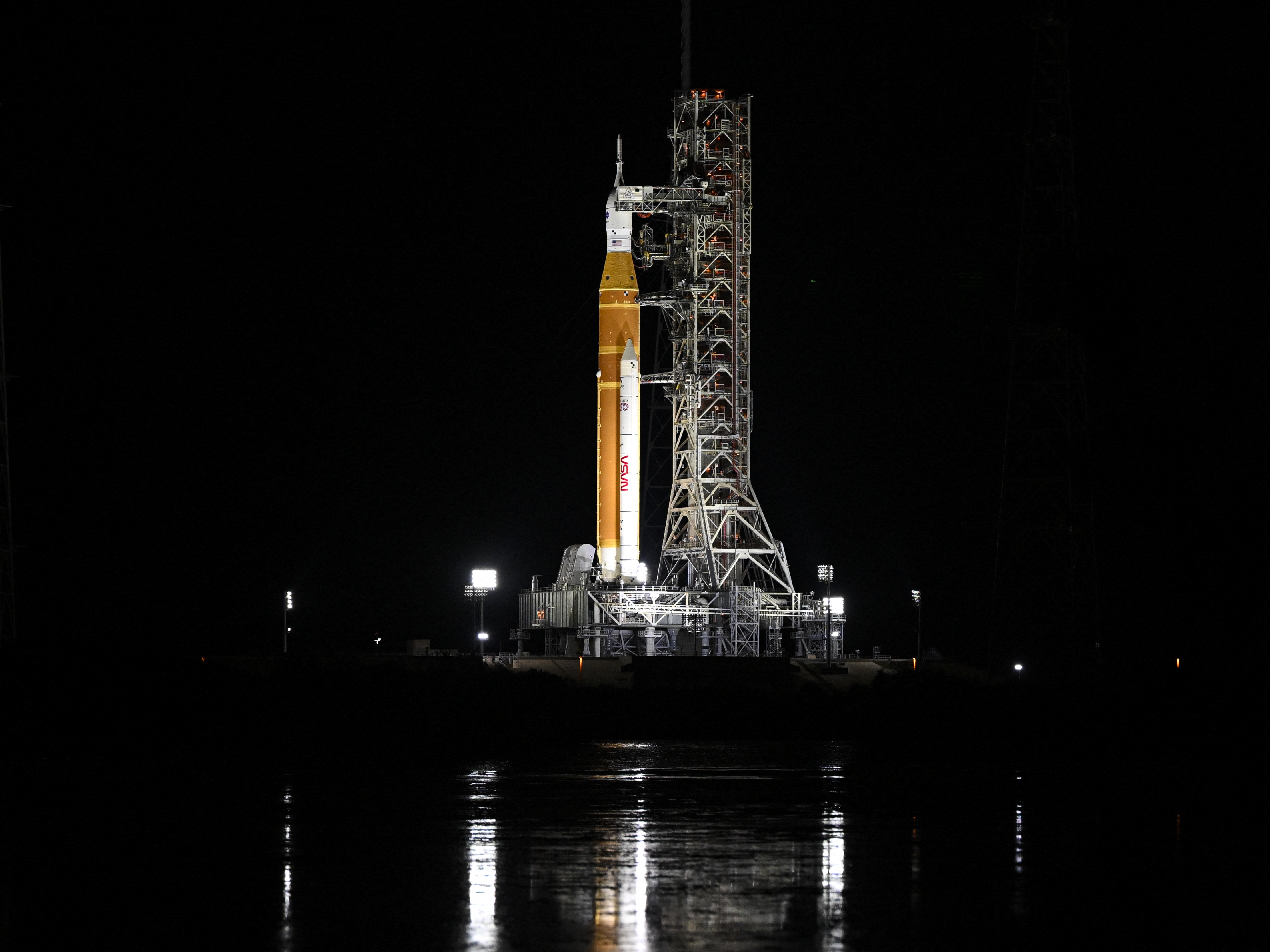 caption: The Space Launch System (SLS) rocket and the Orion spacecraft are seen at the Kennedy Space Center in Cape Canaveral, Fla., on Sunday.