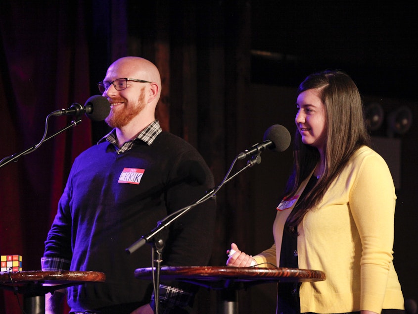 caption: Contestants compete in <em>Ask Me Another's</em> final round at the Bell House in Brooklyn, New York.
