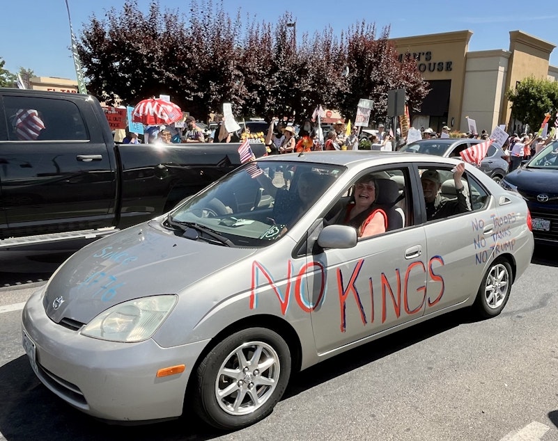 caption: Thousands of protestors lined the streets in Medford, Oregon, on Saturday, June 14, 2025.