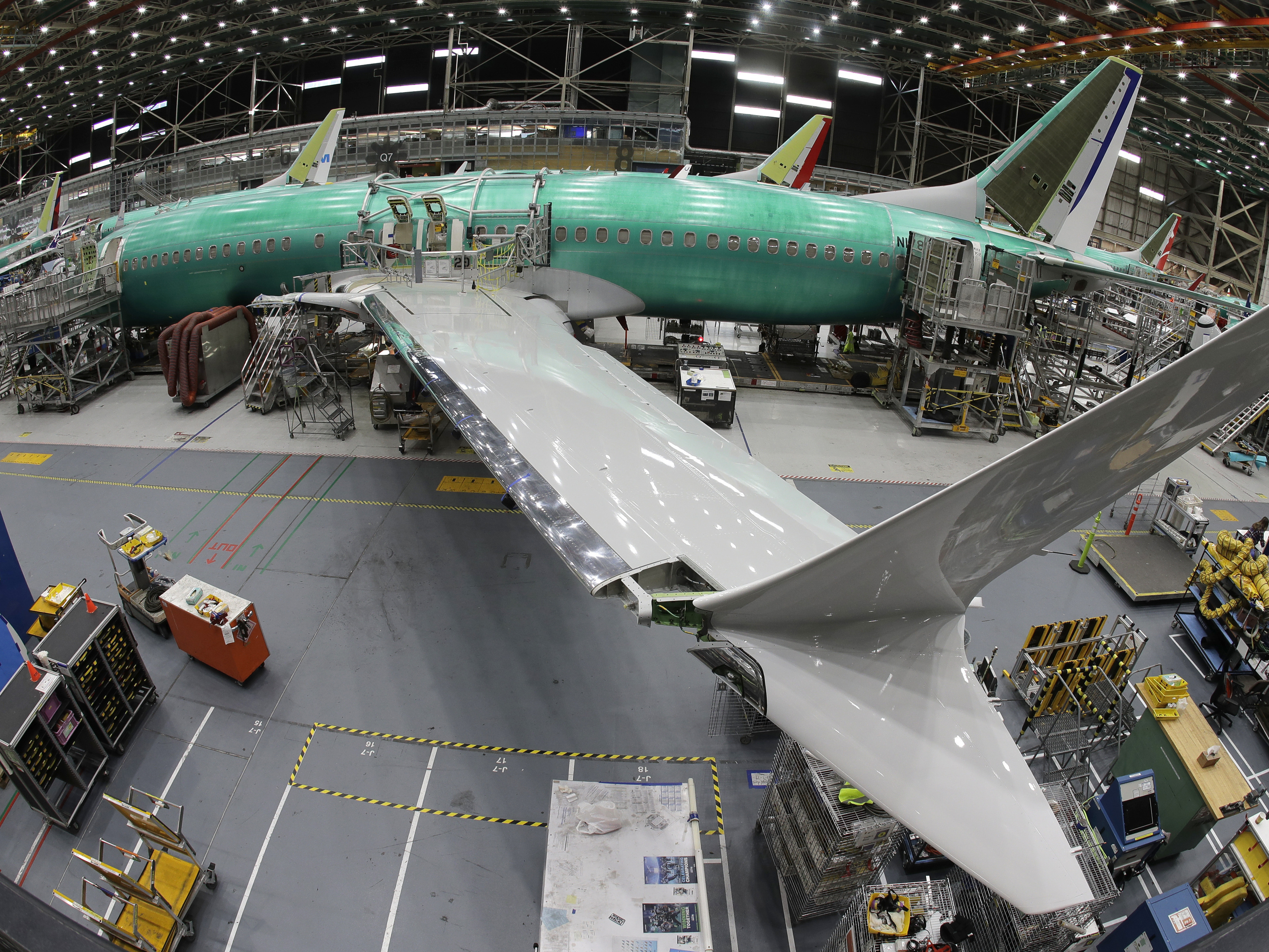 caption: A 737 Max 8 undergoes final assembly inside Boeing's factory in Renton, Wash., on March 27, 2019. Kansas-based Spirit AeroSystems makes the fuselages and ships them to Washington. A series of production issues at Spirit have led to problems.