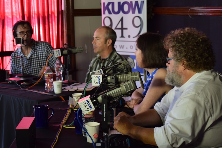 caption: KUOW's Bill Radke discusses the week's news with Bill Finkbeiner, Erica C. Barnett and Knute Berger in front of a live audience at University Heights as part of the of the 'Week in Review' summer tour.