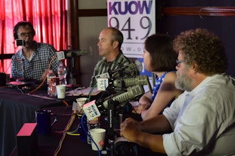 caption: KUOW's Bill Radke discusses the week's news with Bill Finkbeiner, Erica C. Barnett and Knute Berger in front of a live audience at University Heights as part of the of the 'Week in Review' summer tour.