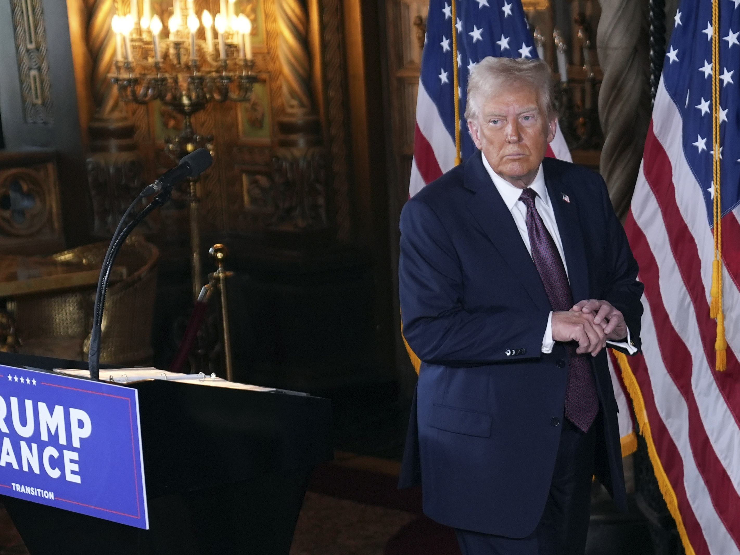 caption: President-elect Donald Trump walks from the podium after a news conference at Mar-a-Lago, Tuesday, Jan. 7, 2024, in Palm Beach, Fla.