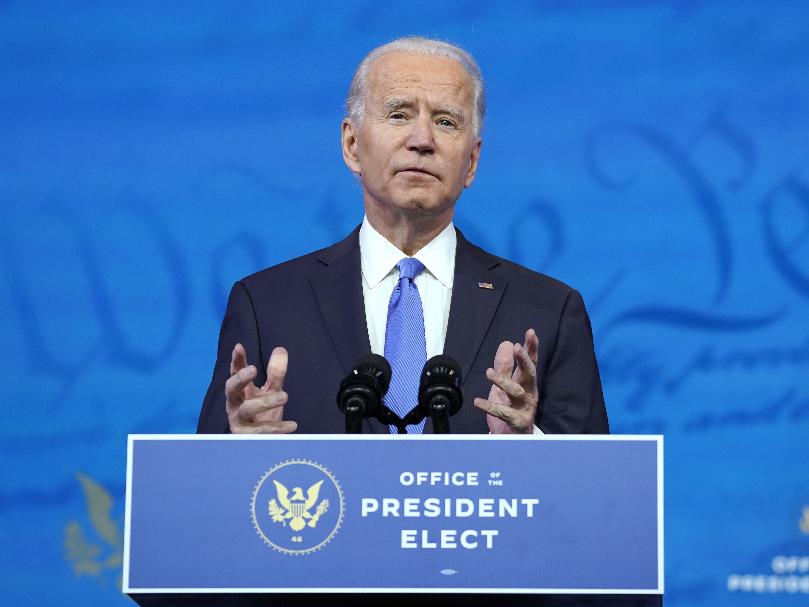 caption: President-elect Joe Biden, here on Monday, says he plans to get vaccinated publicly for the coronavirus.