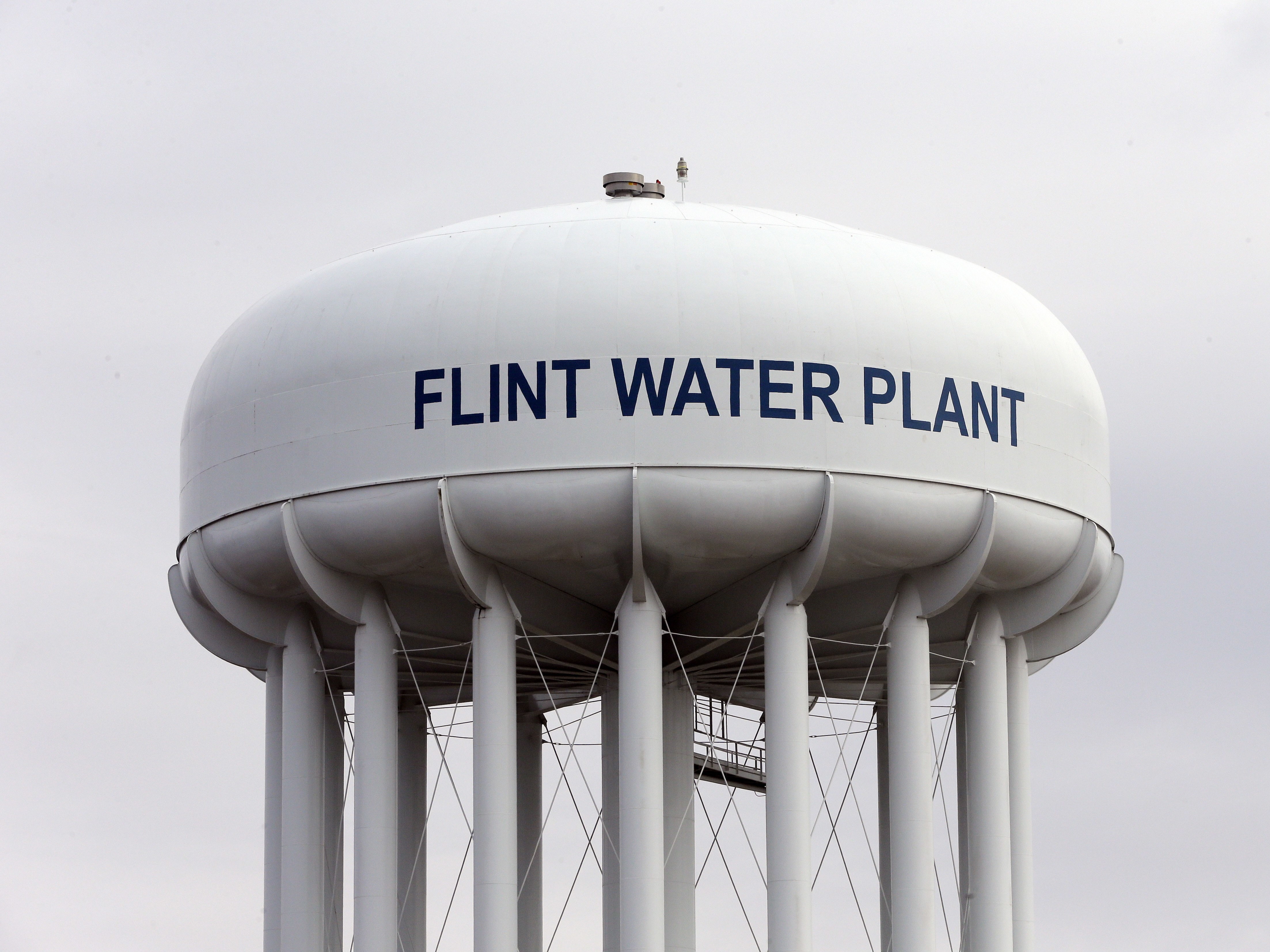 caption: The Flint Water Plant tower in Flint, Mich., where drinking water became tainted after the city switched from the Detroit system and began drawing from the Flint River in April 2014 to save money.