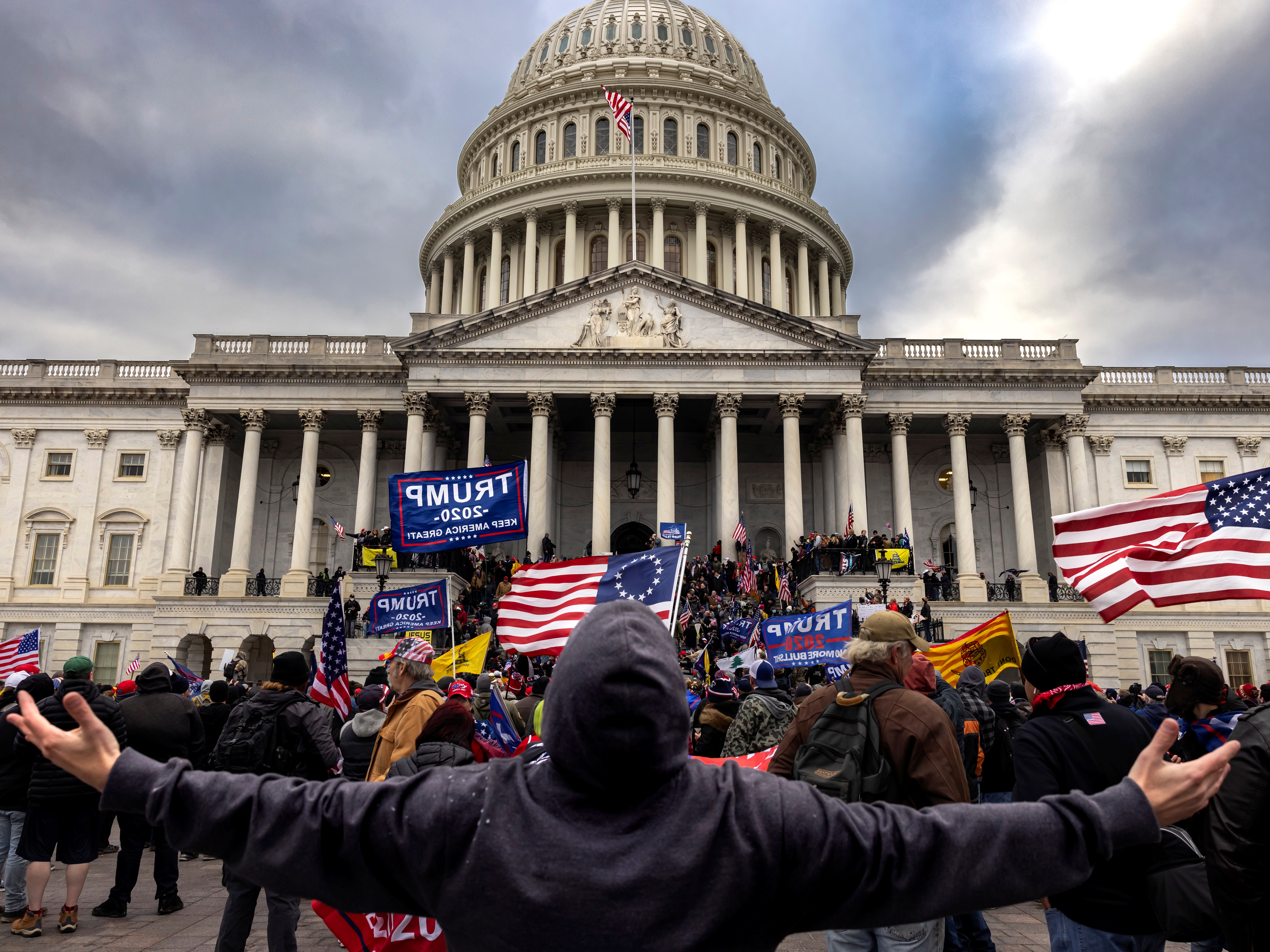 caption: Pro-Trump protesters gather in front of the U.S. Capitol Building on Jan. 6, 2021 in Washington, D.C. Trump supporters gathered in the nation's capital to protest the ratification of President-elect Joe Biden's Electoral College victory over President Trump in the 2020 election. 