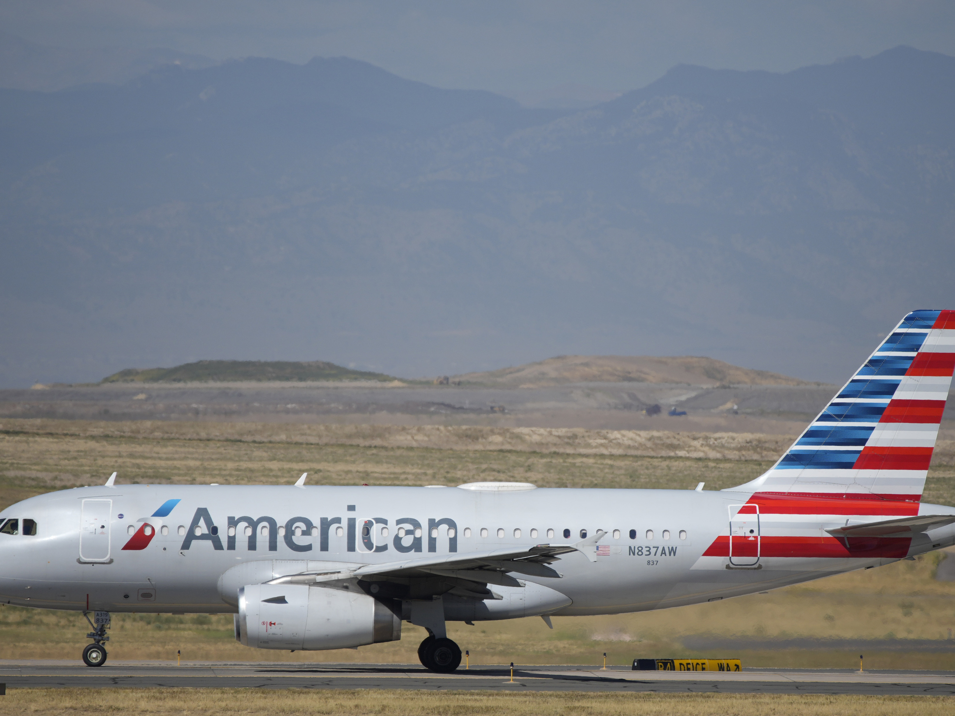 caption: American Airlines released a statement saying, "This behavior must stop, and aggressive enforcement and prosecution of the law is the best deterrent."