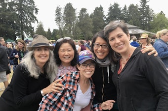 caption: Terri Chung, second from left, the author of this essay, with friends who like to hug at a ZooTunes concert in Seattle.