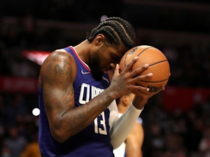 caption: Paul George of the Los Angeles Clippers says the new Wilson ball doesn't feel the same as the old Spalding one.