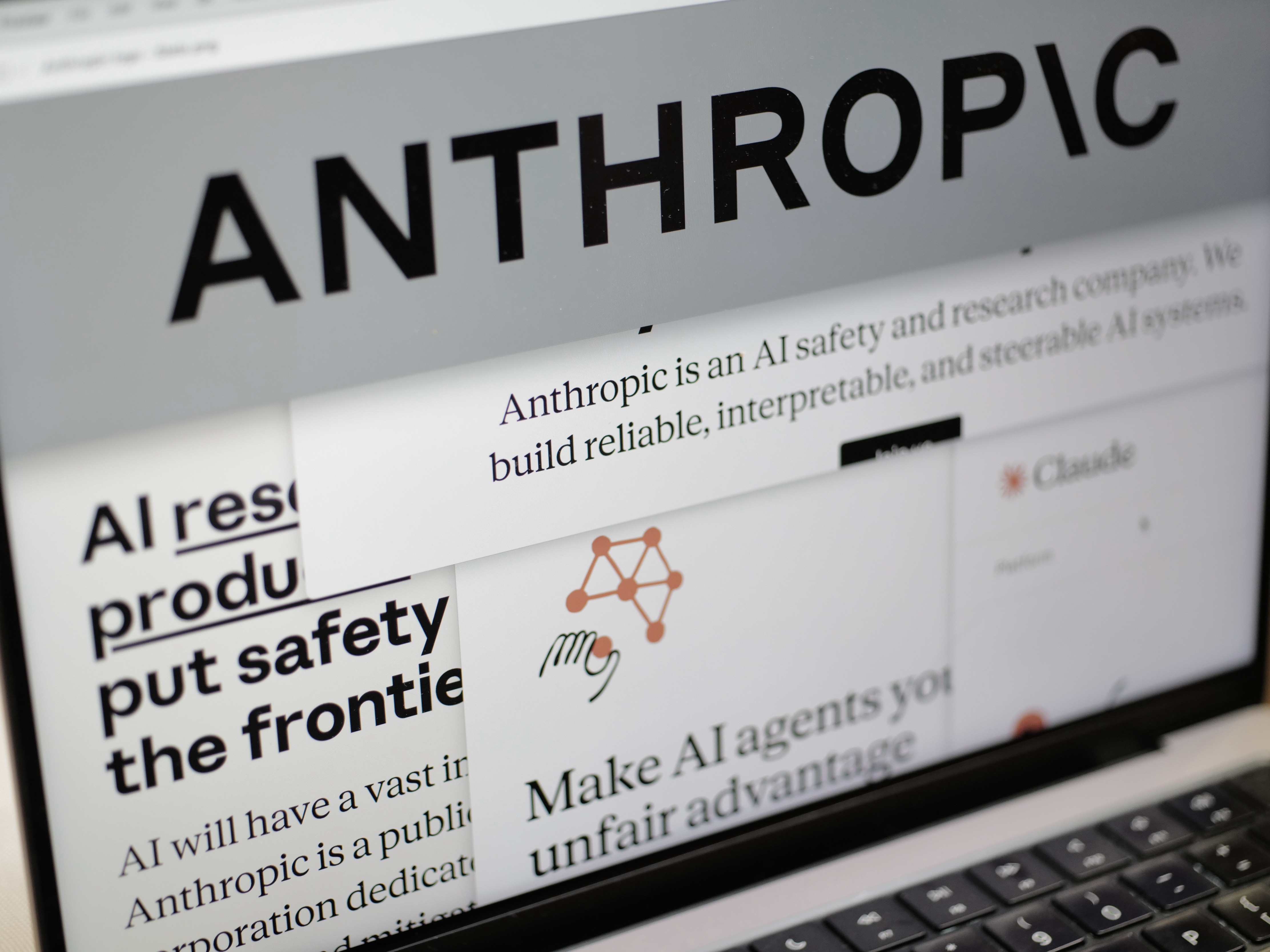caption: Pages from the Anthropic website and the company's logo are displayed on a computer screen in New York on Thursday, Feb. 26, 2026.