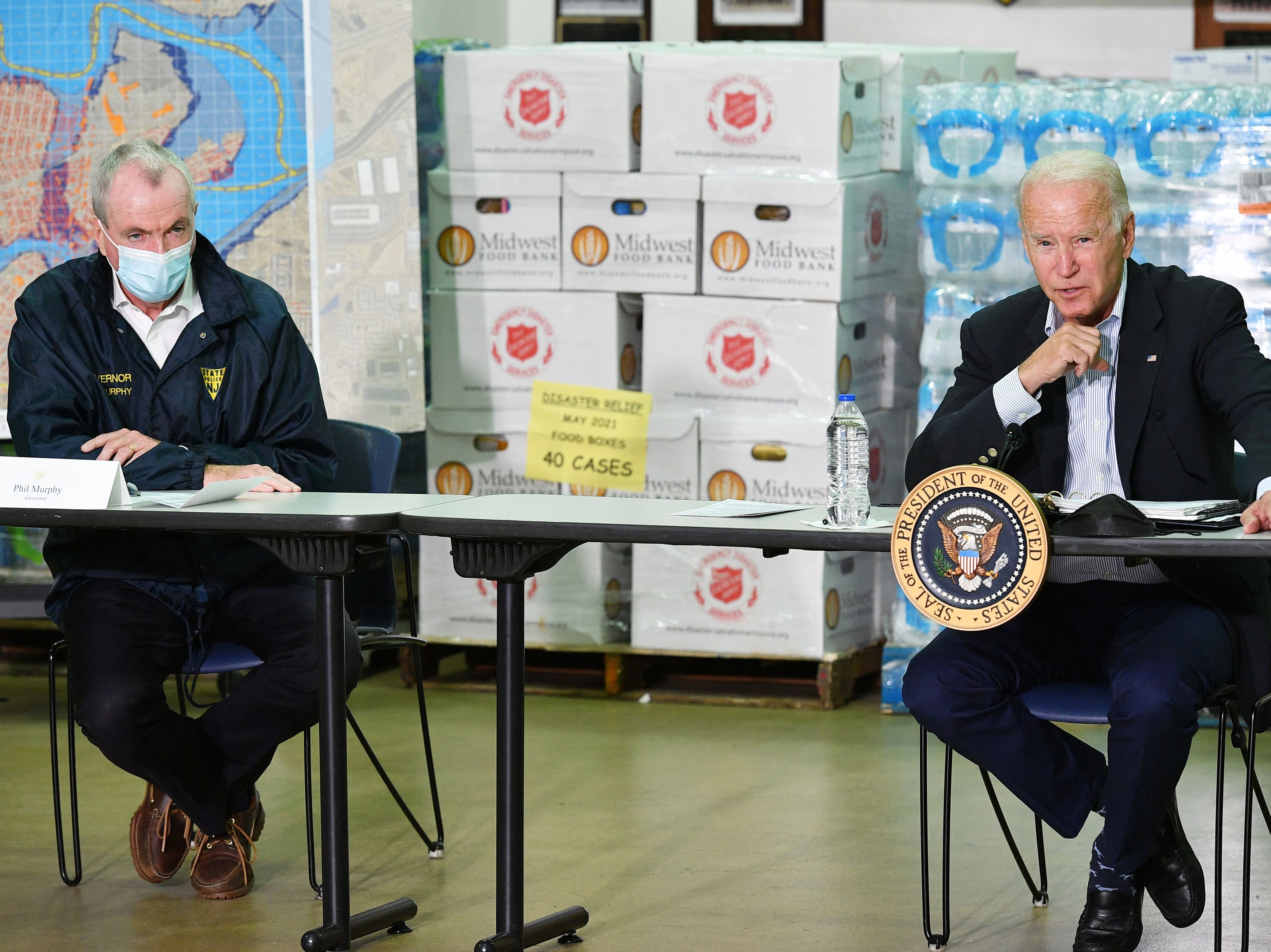 caption: President Biden takes part in a briefing with New Jersey Governor Phil Murphy and other local leaders in the aftermath of Hurricane Ida on Tuesday.