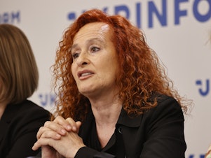 caption: Senior Crisis Advisor of Amnesty International Donatella Rovera (center) released a report August 4, 2022 condemning the Ukrainian army for putting civilians at risk, a possible war crime.