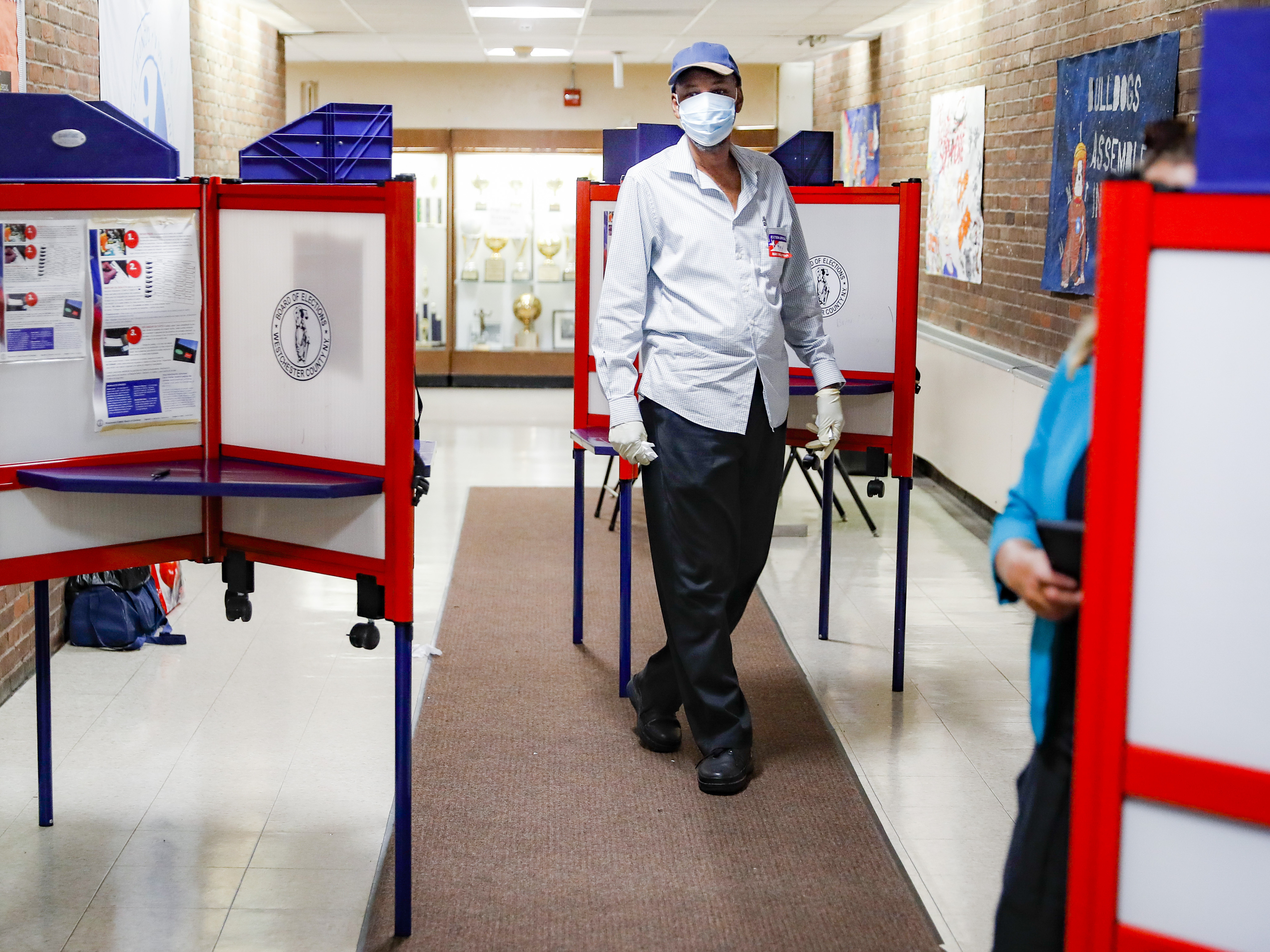 caption: Poll workers must take extra precautions this year to protect themselves against the coronavirus. Election experts fear a massive shortage of workers at the polls in November.