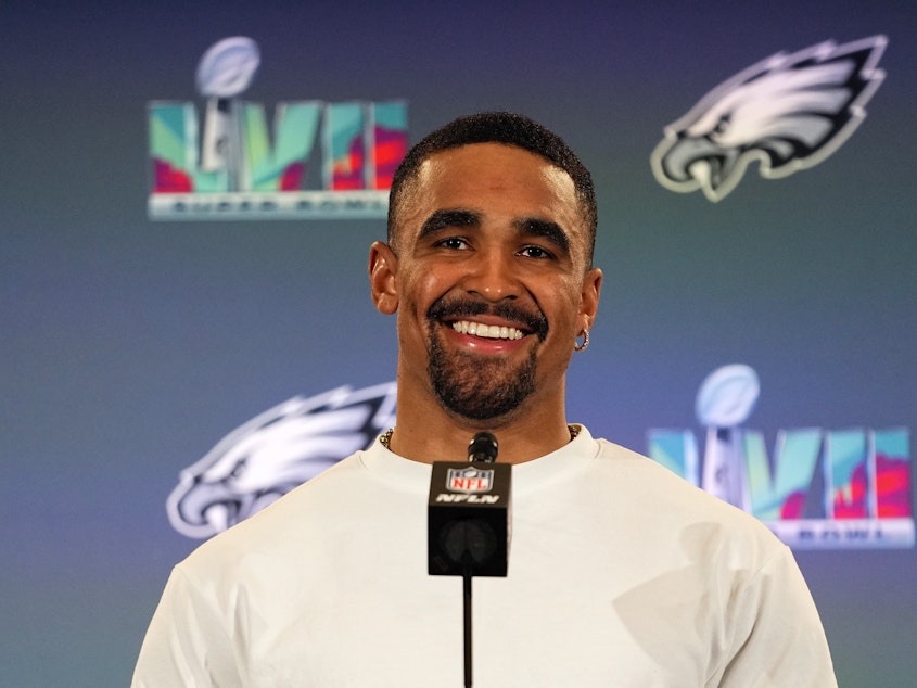 caption: Philadelphia Eagles quarterback Jalen Hurts speaks during an NFL football Super Bowl team availability, Wednesday, Feb. 8, 2023, in Phoenix. Jalen Hurts is set to sign one of the richest deals in NFL history, agreeing to a five-year, $255 million extension with the Philadelphia Eagles, including $179.3 million guaranteed, a person with knowledge of the situation told The Associated Press.