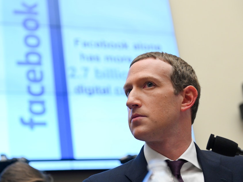 caption: Facebook says it will continue to allow political ads to be targeted to only small groups of its users. Here, Facebook Chairman and CEO Mark Zuckerberg is seen visiting Congress for a hearing last October.