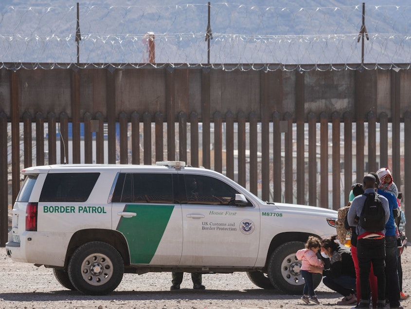 caption: Border Patrol agents apprehend a group of migrants near downtown El Paso, Texas, on Monday. The Department of Homeland Security is struggling to manage a growing number of unaccompanied minors at the border.