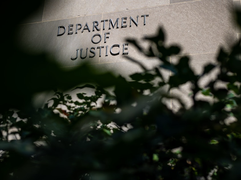 caption: Attorney General Merrick Garland has set new restrictions on the political activities of some Justice Department employees.