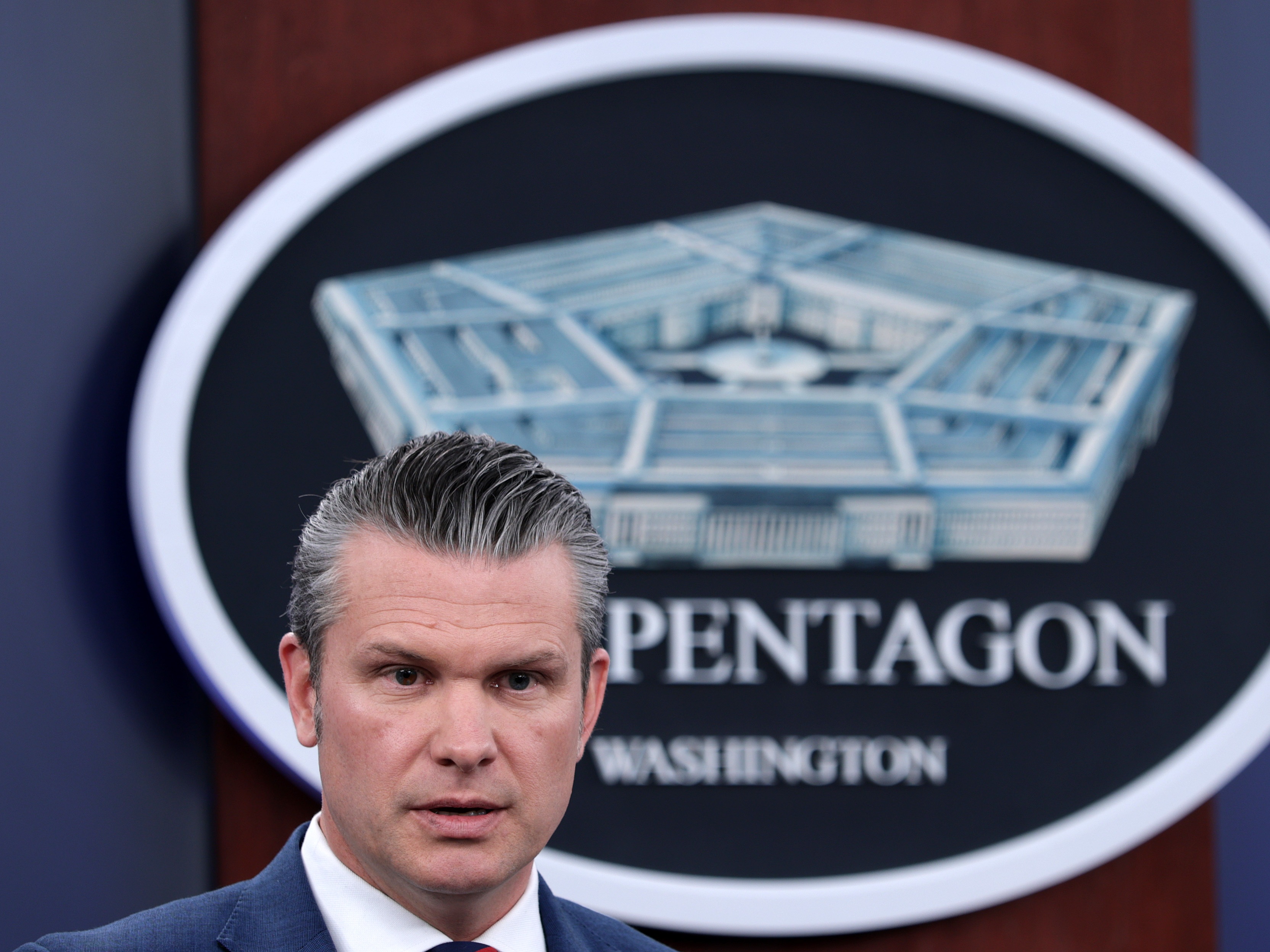 caption: Secretary of Defense Pete Hegseth speaks during a news conference at the Pentagon on March 2, 2026 in Arlington, Va.