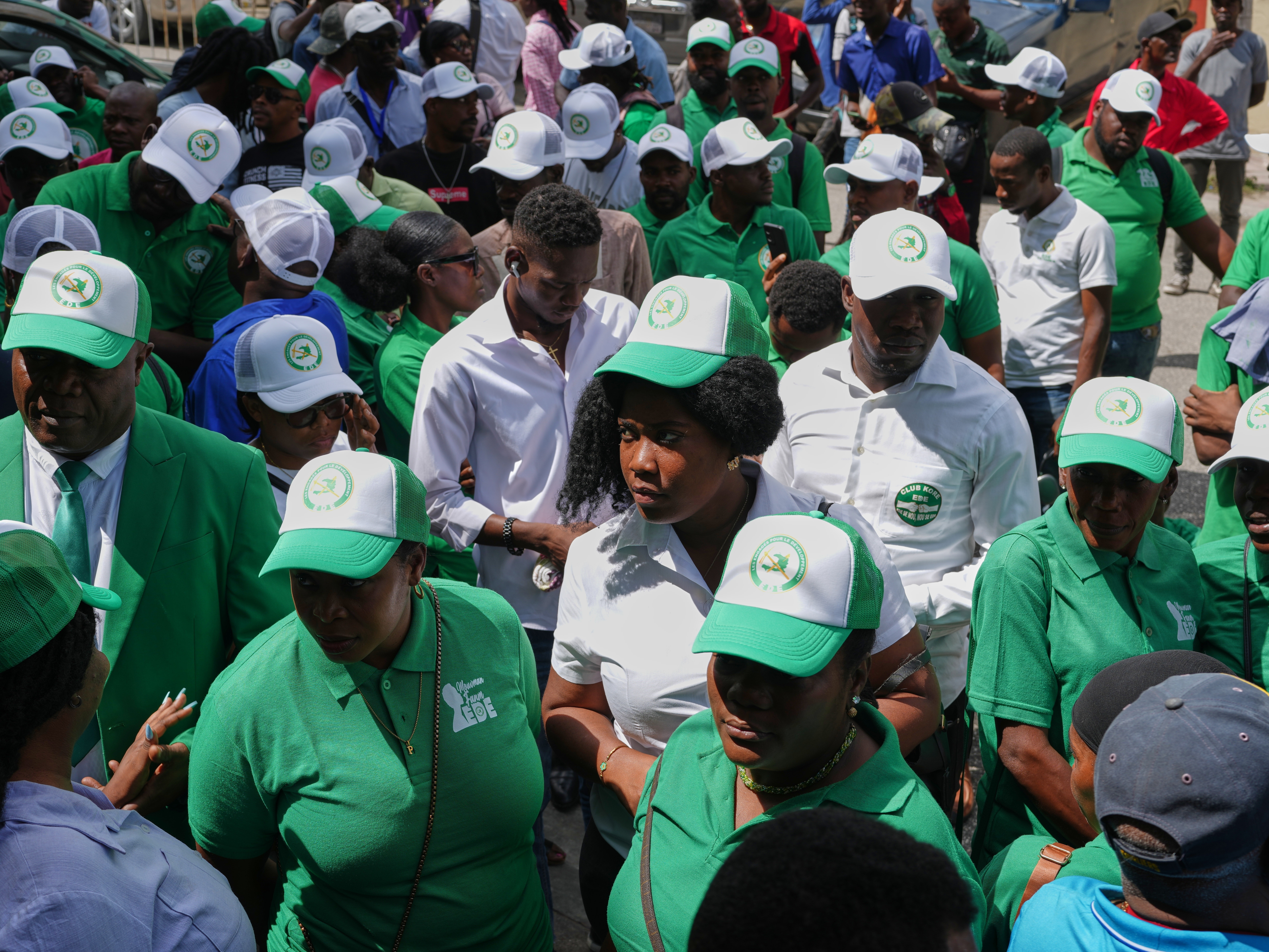 caption: Members of the EDE (Committed to Development) political party arrive to register the party at the Provisional Electoral Council in the Petion-Ville neighborhood of Port-au-Prince, Haiti, Thursday, March 12, 2026.