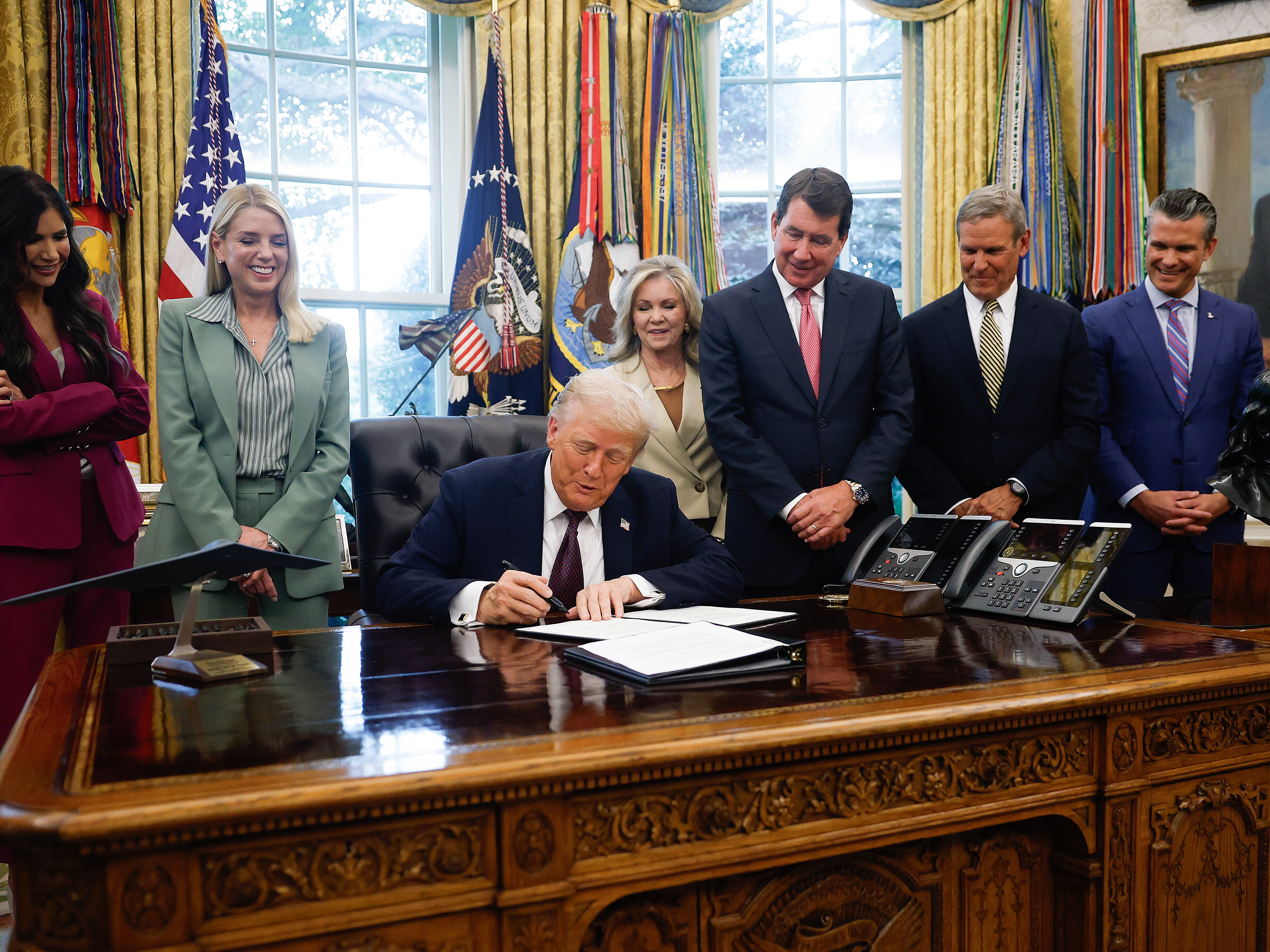 caption: President Trump signed a memorandum on September 15, 2025 in Washington, D.C. that will send members of the National Guard and federal law enforcement agencies to Memphis, Tenn.