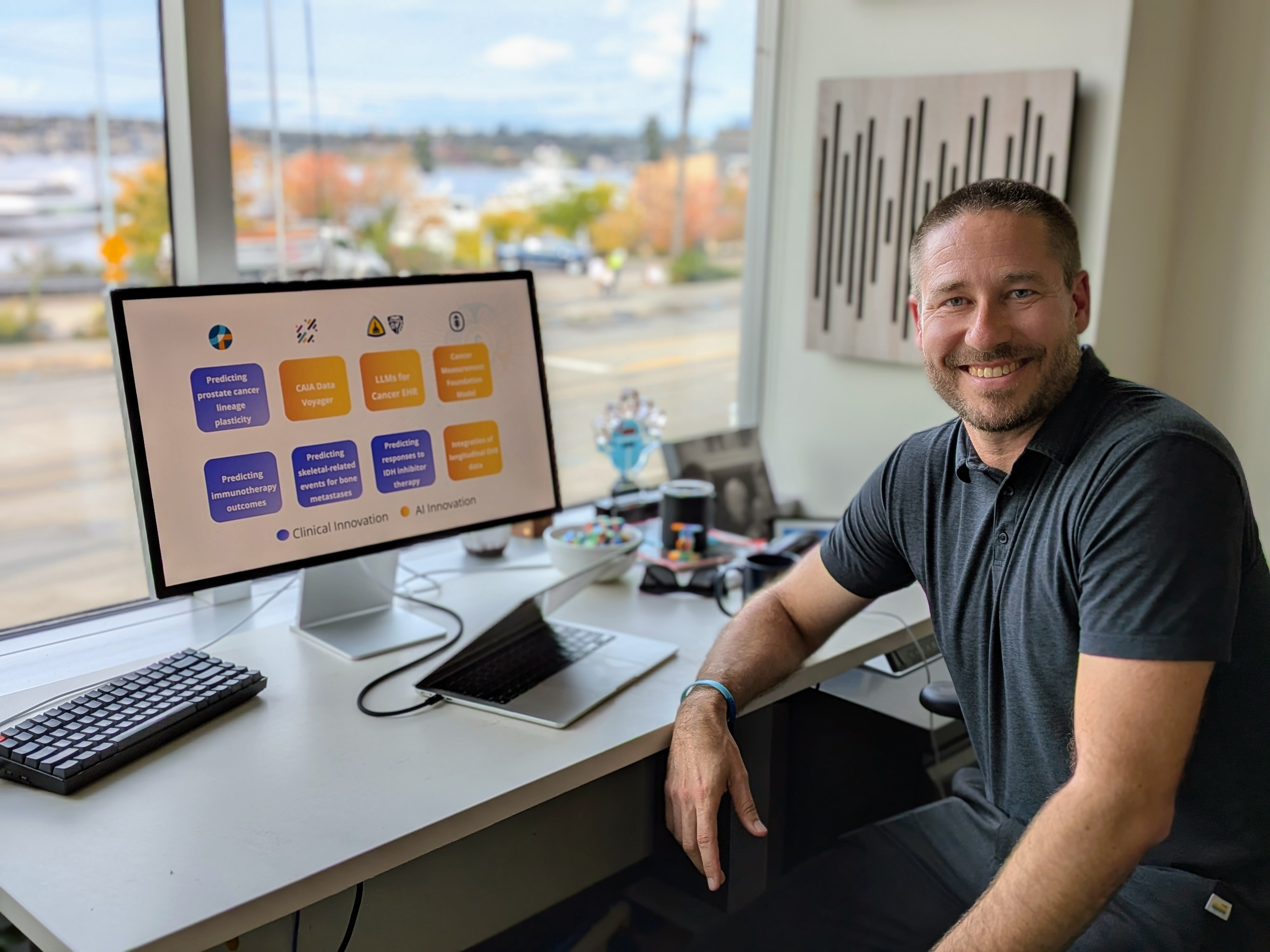 caption: Fred Hutch Chief Data Officer demos the new Cancer AI Alliance Platform at his office in Seattle.