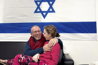 caption: Emily Hand, 9, shown with her father Tom Hand, was one of the Israeli hostage released Saturday by Hamas. Israeli authorities first thought she was killed in the Hamas attack on Oct. 7, but the Israeli military later determined she was alive. She was reunited with her father in the early hours of Sunday.