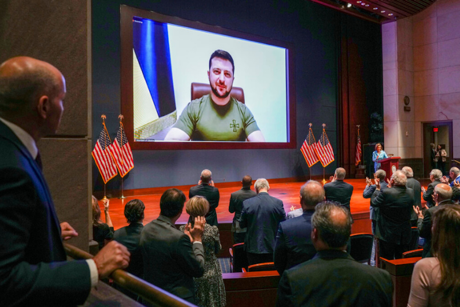 caption: Members of Congress give Ukraine President Volodymyr Zelensky a standing ovation before he speaks in a virtual address to Congress in the U.S. Capitol Visitors Center Congressional Auditorium in Washington, Wednesday, March 16, 2022. 
