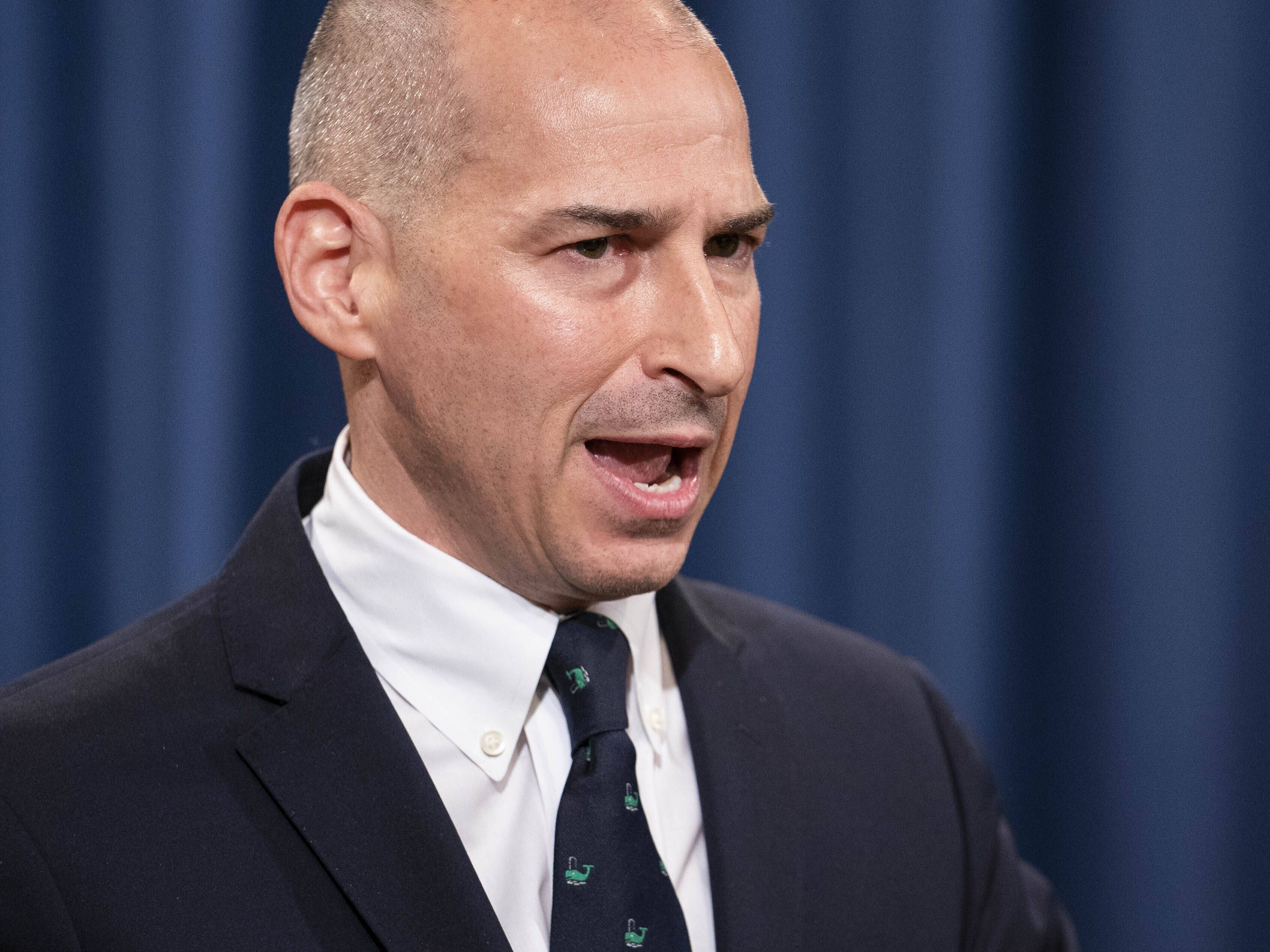caption: Then-acting U.S. Attorney Michael Sherwin speaks during a news conference on Jan. 12. After an interview Sherwin gave about the ongoing Capitol insurrection investigation, a federal judge criticized the Justice Department with a potential gag order.