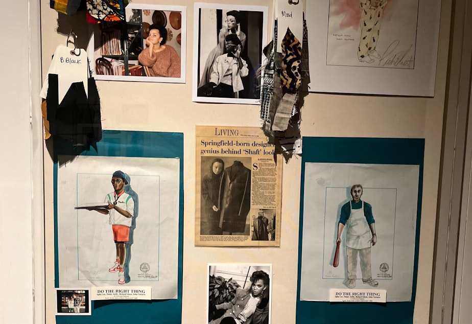 caption: Here, Carter's early designs and textile inspirations are on display. Carter finds designs and patterns by immersing herself in the region or time period the film takes place in. 