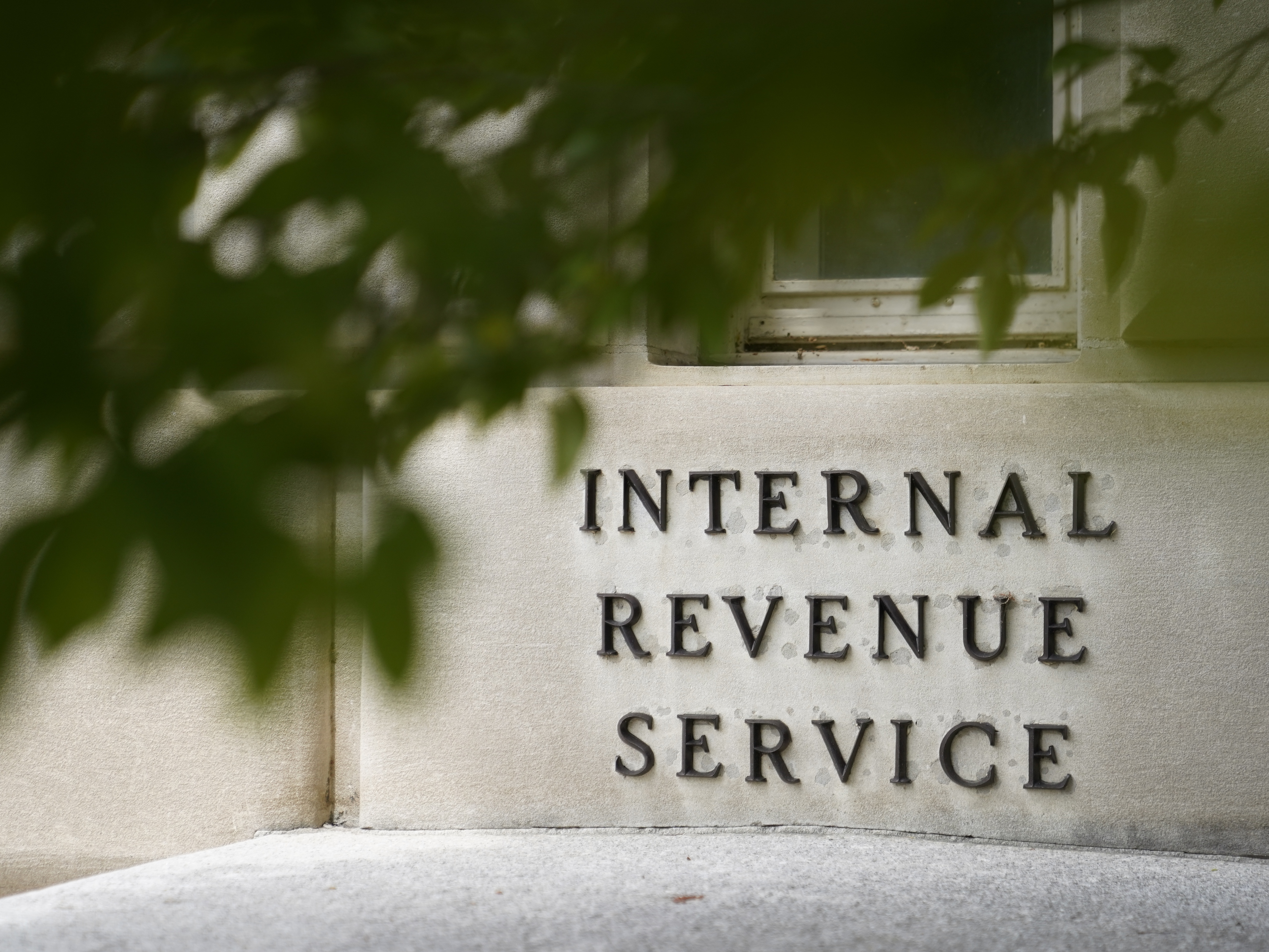 caption: A sign is displayed outside the Internal Revenue Service building on May 4, 2021, in Washington. (AP Photo/Patrick Semansky, File)