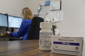 caption: Access to the abortion drug mifepristone could soon be limited by the Supreme Court for the whole country. Here, a nurse practitioner works at an Illinois clinic that offers telehealth abortion.
