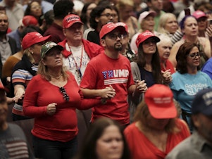 caption: Supporters of President Donald Trump pray during a rally for evangelical supporters at the King Jesus International Ministry church, Friday, Jan. 3, 2020, in Miami.