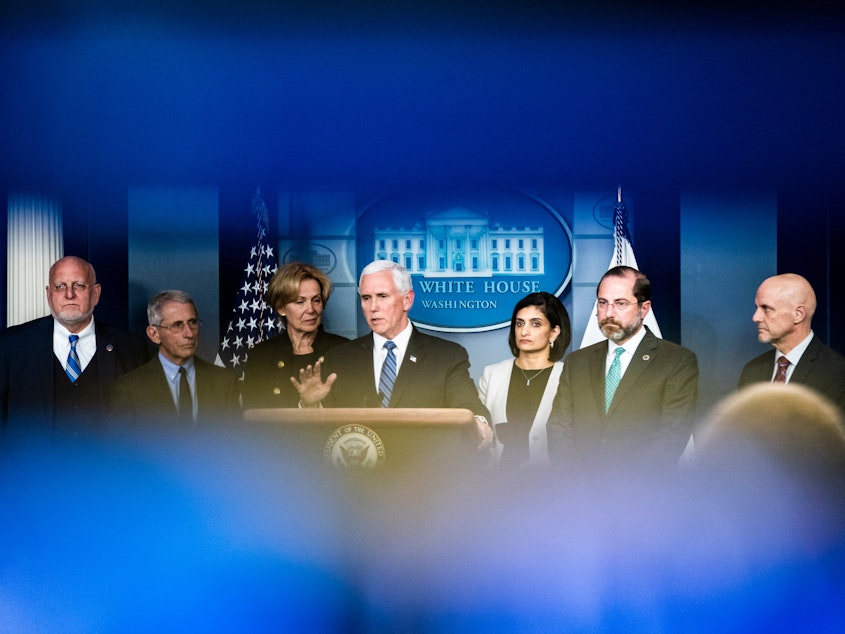 caption: Vice President Mike Pence leads a press briefing along with members of the Coronavirus Task Force formed by the White House in response to the outbreak.